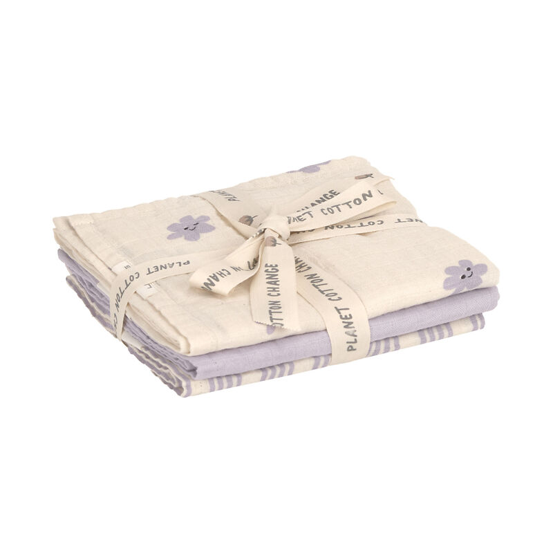 Stapel katoenen stoffen doeken in beige en lila met bloemenprint, samengebonden met lint