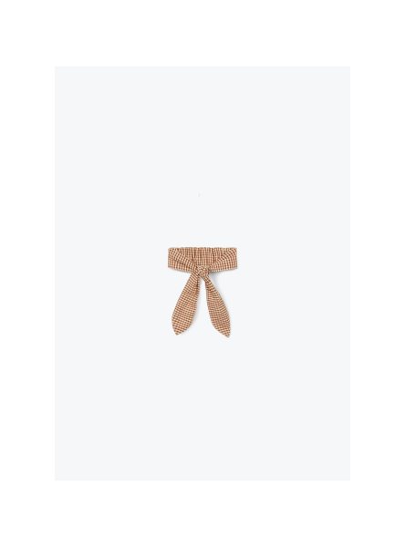 Beige geruite haarband met strikdetail en bruine ruitjes patroon
